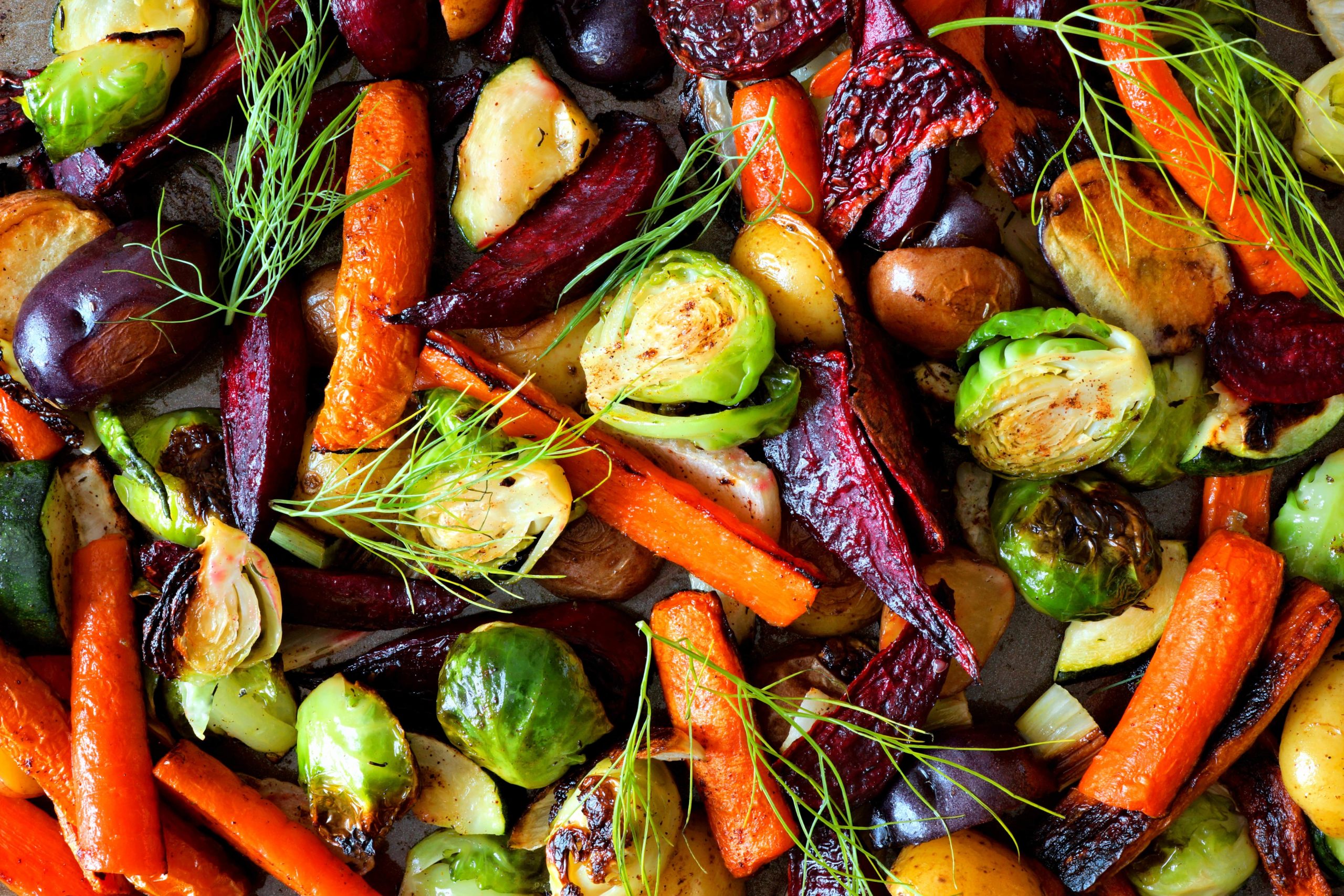 Cooked burssel sprouts, carrots, potatoes, and beats tossed together.