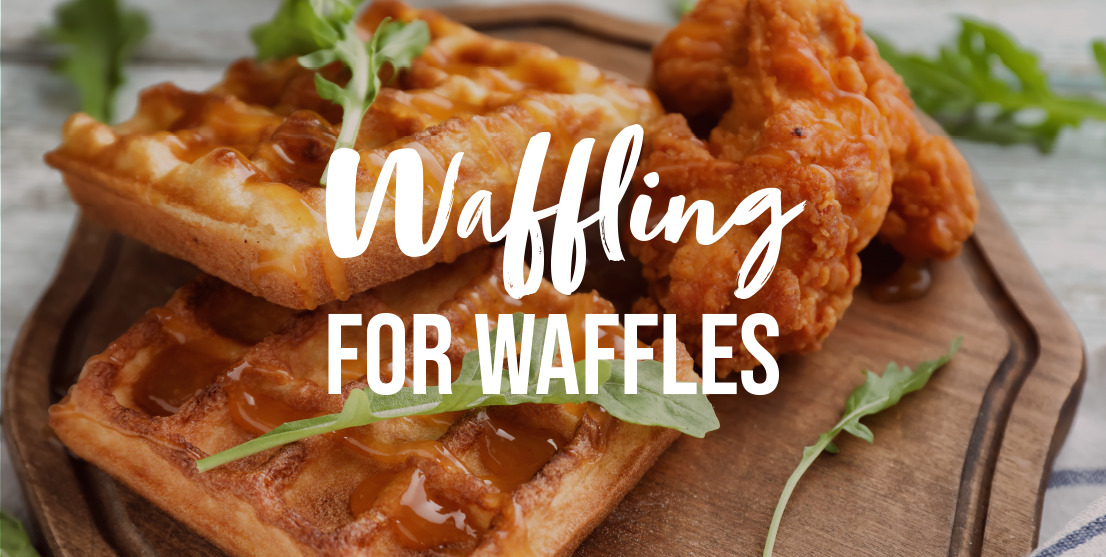 Waffling for Waffles: garnished chicken and waffles on a wooden serving platter