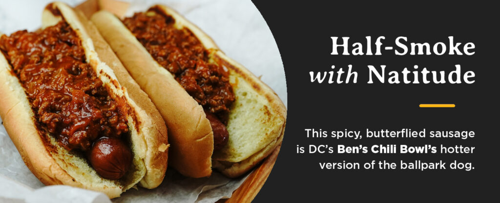 Half-smoke sausage with chili on a grilled bun