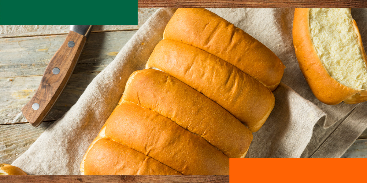 a bunch of rolls are sitting on a cloth on a table
