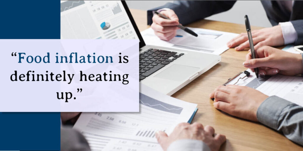 a sign that says food inflation is definitely heating up