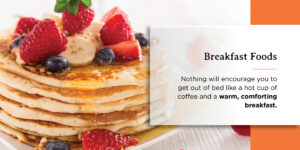 a stack of pancakes with strawberries and blueberries on top