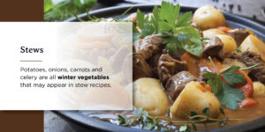 pot of stew with potatoes onions carrots and celery 
