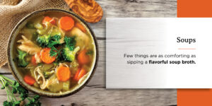 a bowl of soup with carrots broccoli and other vegetables