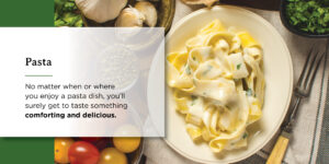 a white plate topped with pasta and a fork on a table .