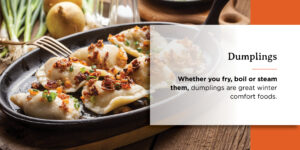 a plate of dumplings with a fork on a wooden table .