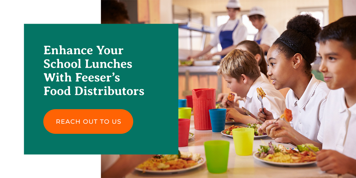 a group of children are sitting at a table with plates of food and a button that says reach out to us