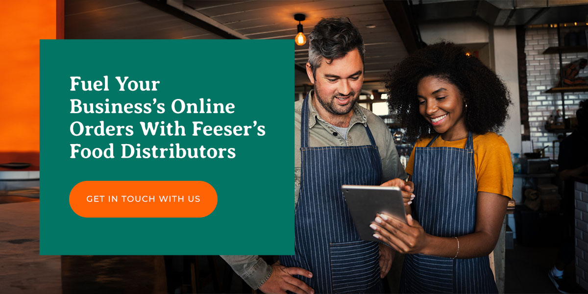 a man and a woman looking at a tablet with the words fuel your business 's online orders